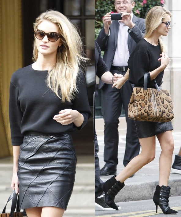 Rosie Huntington-Whiteley wearing the all-black Isabel Marant 'Tacy' boots with a leather miniskirt and a blouse in Paris on September 25, 2013
