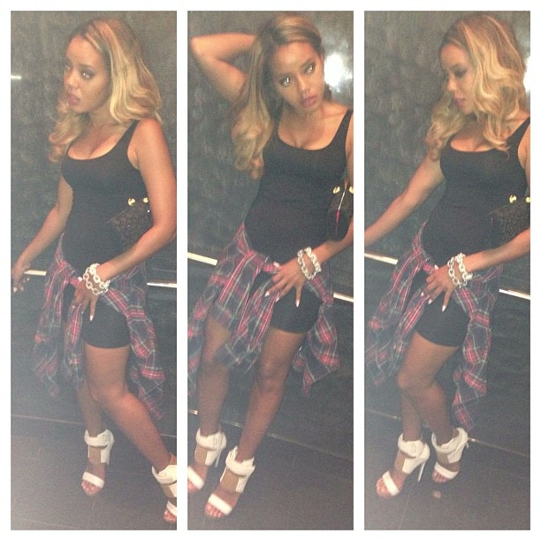 Angela Simmons styles a pair of white MIA Limited Edition "Rocco" sandals with a black dress and a flannel shirt