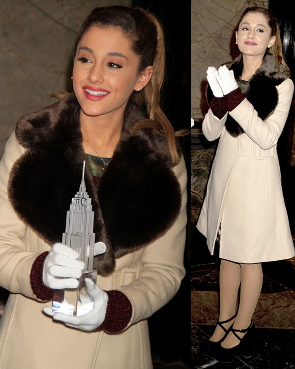 Ariana Grande wears a beige coat with sexy stockings and white gloves to the Empire State Building