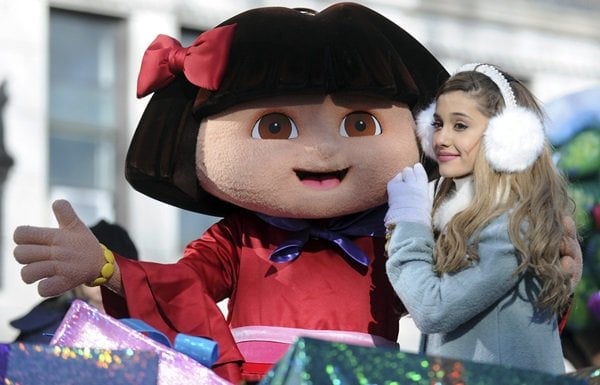 Ariana Grande covers her hair with large earmuffs as she performs at the 87th annual Macy's Thanksgiving Day Parade
