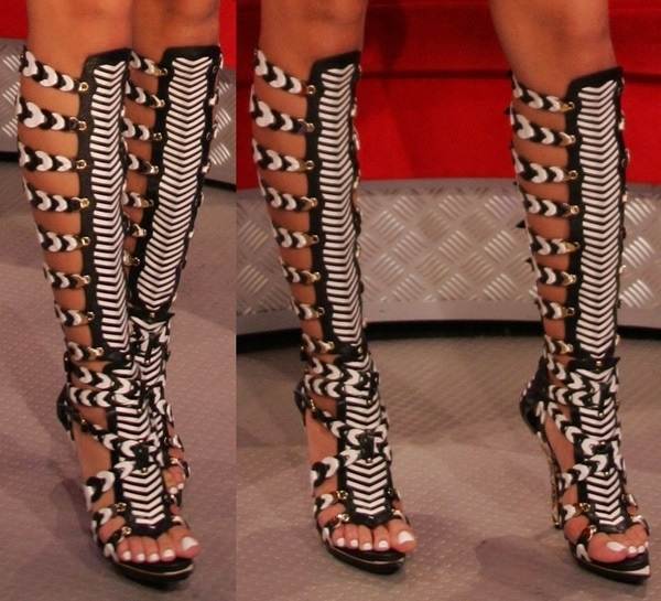 Rihanna in striking $2,000 Balenciaga gladiator heels featuring bold cutouts and intricate lace-up detailing