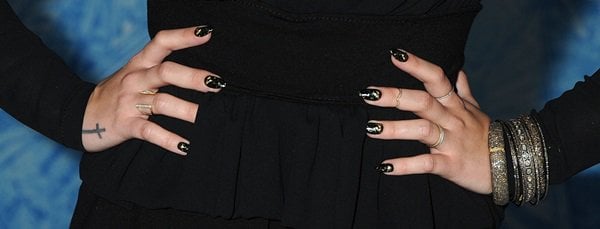 Demi Lovato shows off her rings, bracelets and black nails at the premiere of "Frozen"