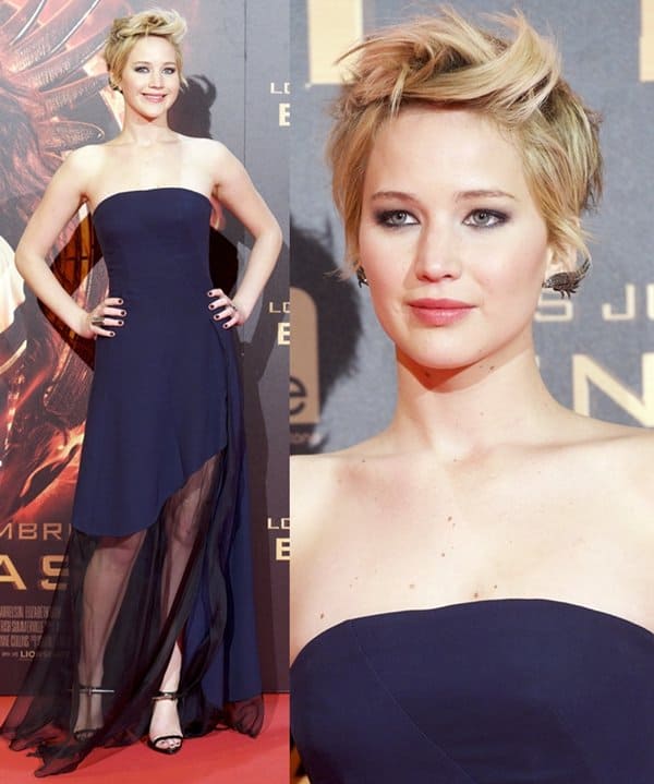 Jennifer Lawrence showcases her swirly hair and stunning Ana Khouri winged earrings at the Madrid premiere of The Hunger Games: Catching Fire on November 13, 2013