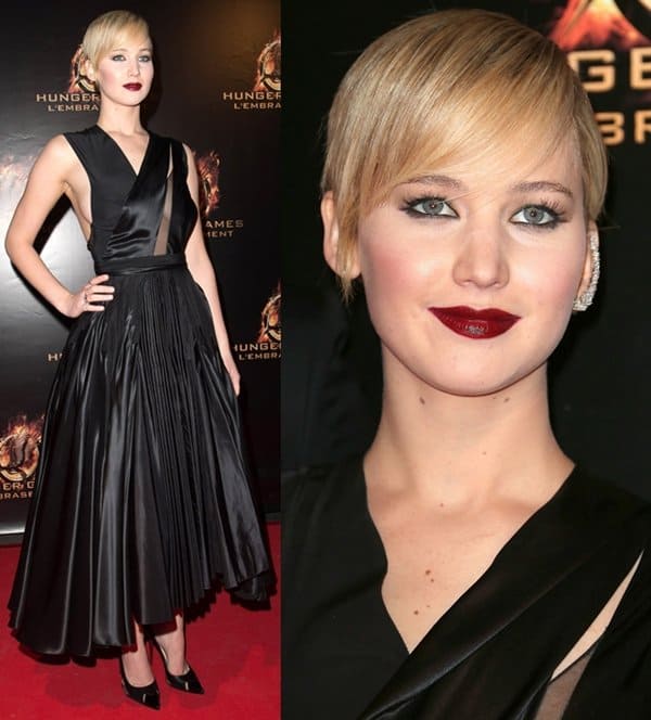 Jennifer Lawrence exudes glamor with bold wine lips and a Christian Dior Fall 2013 Couture silk dress at the Paris premiere of The Hunger Games: Catching Fire on November 15, 2013