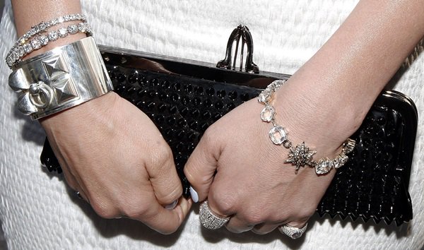 Jennifer Lopez toting a 'Miss Loubi' patent leather studded clutch