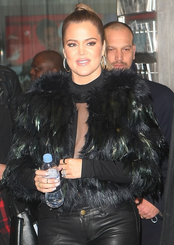 Khloé Kardashian wears a Kardashian Kollection crop feather jacket