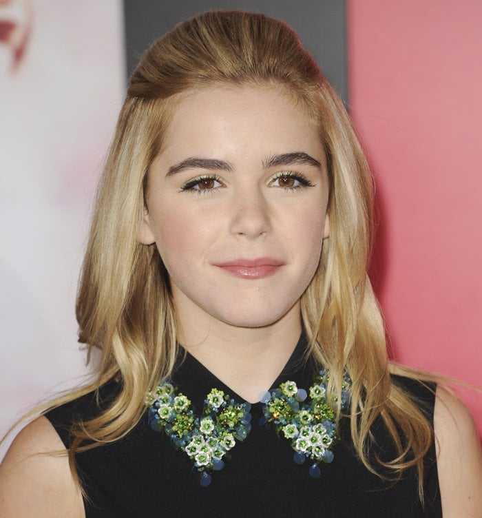 Kiernan Shipka's hair, styled in an elegant half-up, half-down fashion, perfectly framed her face at 'The Hunger Games: Catching Fire' premiere