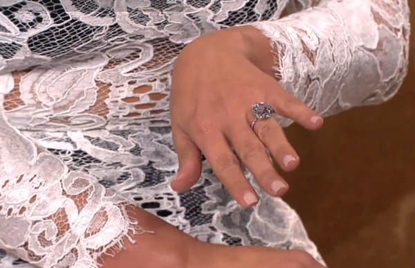 Kim Kardashian's engagement ring showcased against her white lace dress