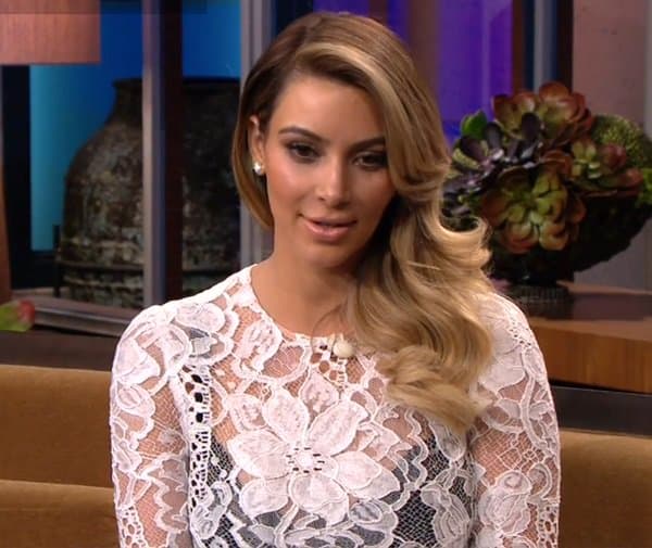 Kim Kardashian wearing a white lace dress during her appearance on the Jay Leno Show