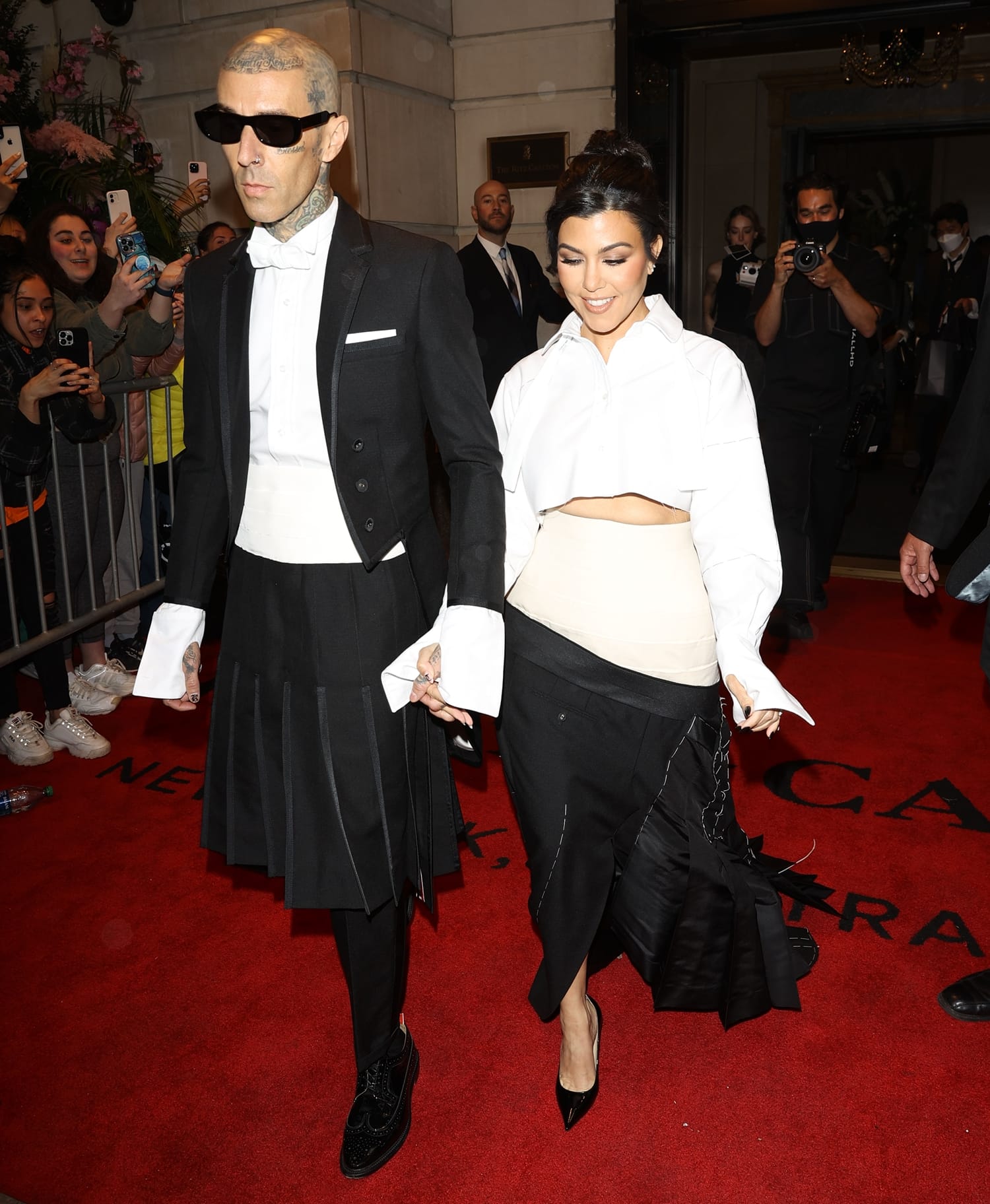 Kourtney Kardashian and Travis Barker leave the Ritz Carlton Hotel on their way to the Met Gala