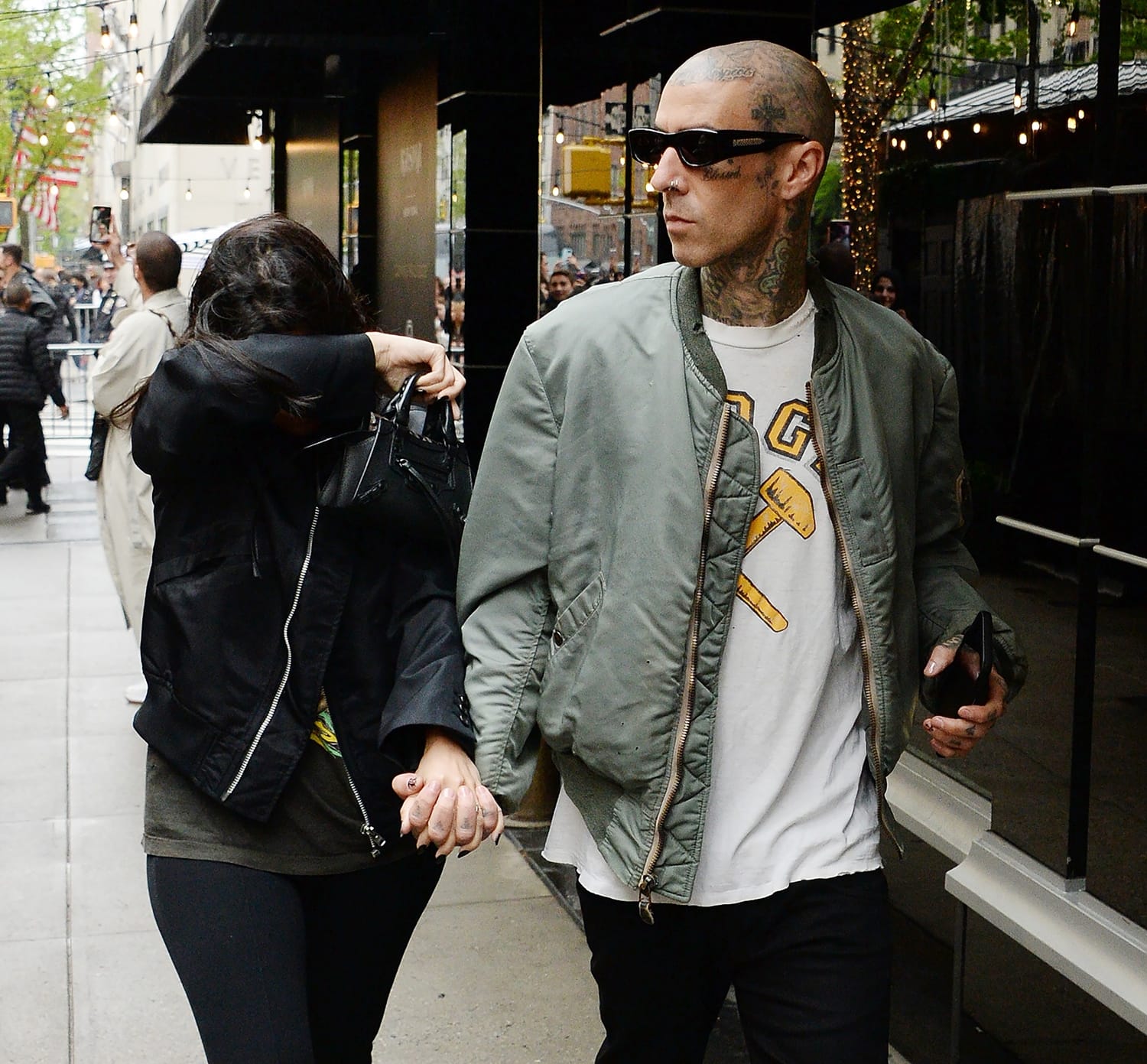 Kourtney Kardashian pretends to be shy on a date with Travis Barker