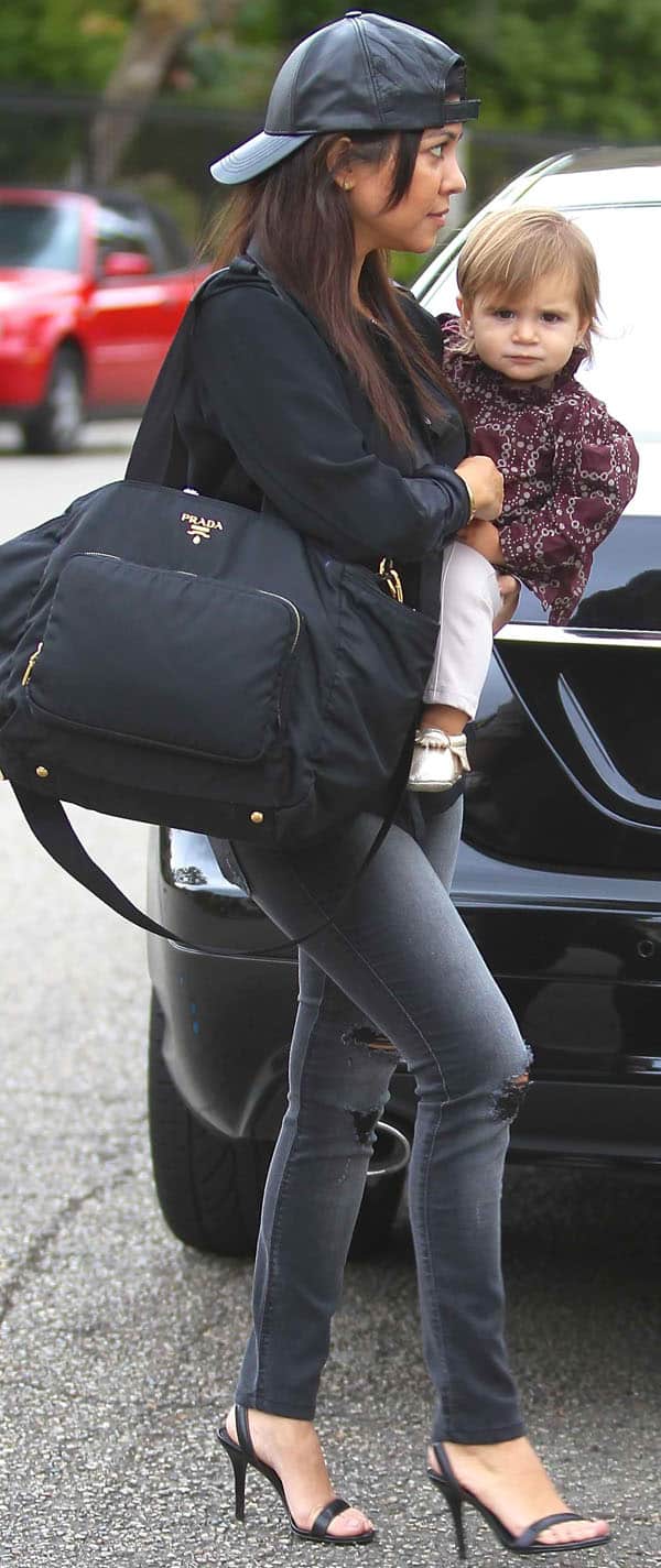 Kourtney Kardashian sports a Hat Attack leather baseball cap for a casual look