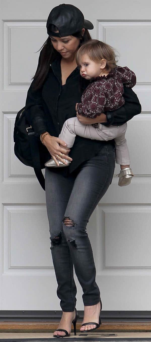 Kourtney Kardashian pairs her Black Orchid jeans with a Kymerah Ripley blouse