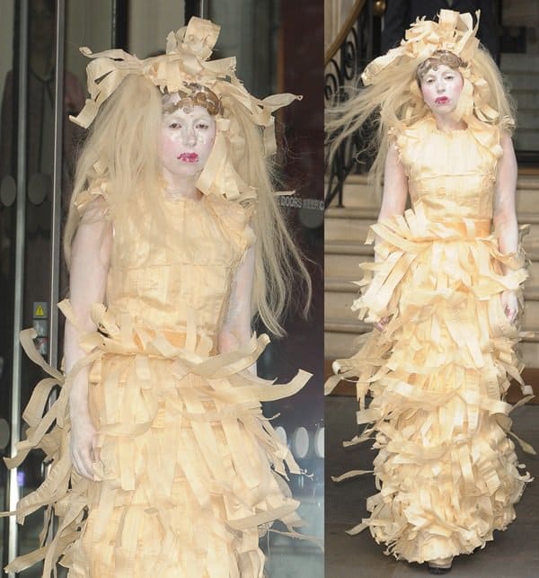 Lady Gaga leaving her hotel in London, wearing a dress made of paper-thin strips of shaved wood, with matching headpiece and dramatic makeup