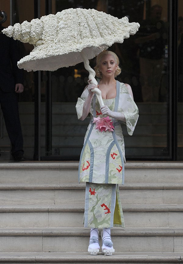 Lady Gaga opted for a Geisha look and sported a kimono-style dress while carrying a huge seashell parasol