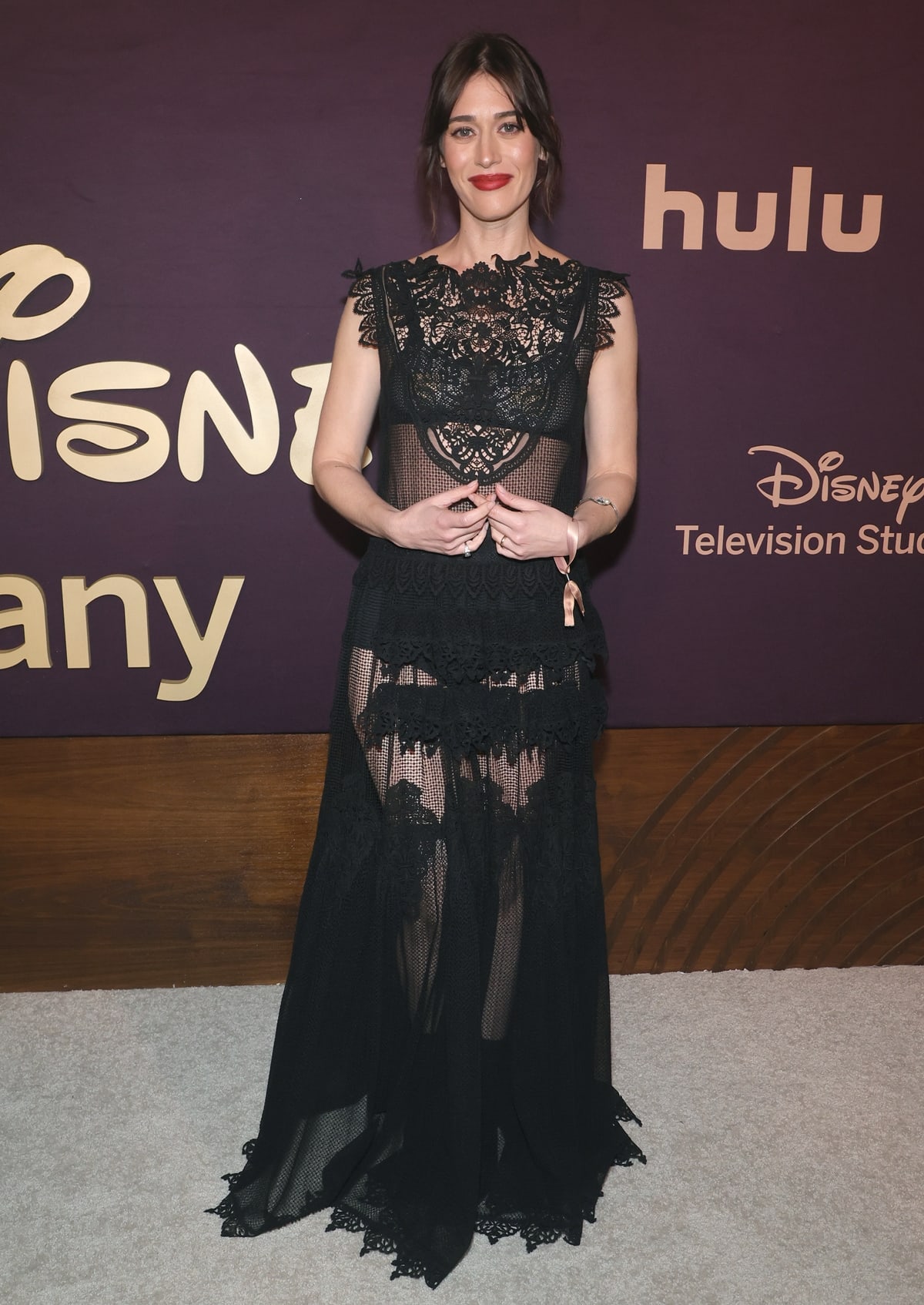 At the Walt Disney Emmy Awards Party in Los Angeles on January 15, 2024, Lizzy Caplan elegantly showcased her support for women's empowerment by wearing a long black lace dress from Maria Grazia Chiuri's Dior Spring-Summer 2024 collection, highlighting Chiuri's renowned feminist-influenced fashion