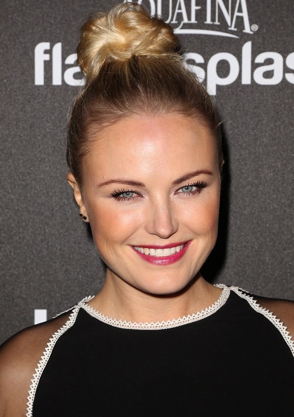 Malin Akerman's magenta lip and chic top-knot hairstyle