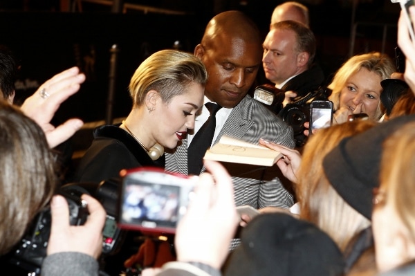 Miley Cyrus signs autographs for her fans at the 2013 Bambi Awards