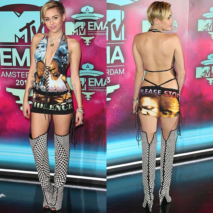 Miley Cyrus at the 2013 MTV Europe Music Awards in Amsterdam, Netherlands, showcasing her peace-promoting dress featuring Notorious B.I.G. and Tupac Shakur