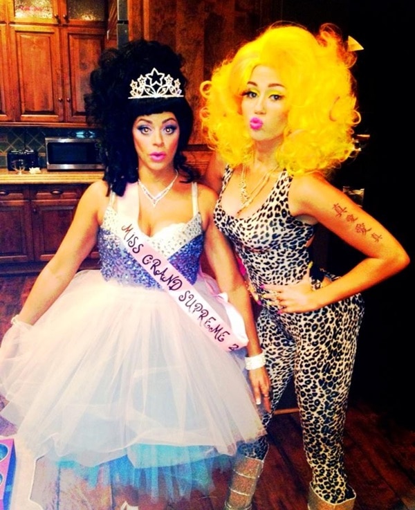 Miley Cyrus channels Nicki Minaj for Halloween, complete with a vibrant yellow wig and leopard-print outfit