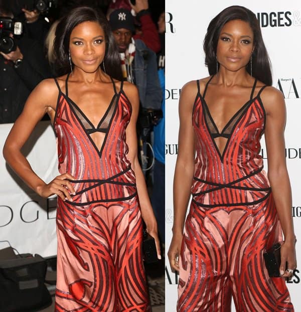 Naomie Harris in a striking Gucci gown with pink, purple, and red stripes, revealing a daring bra detail