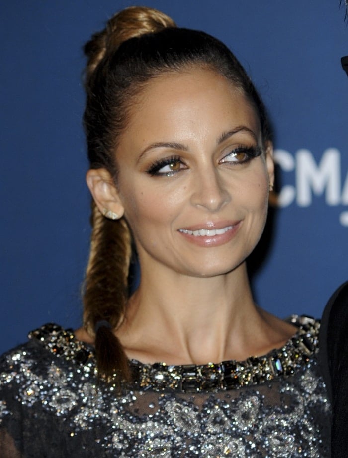 Nicole Richie completed her look with a high fishtail braid, kohl-rimmed eyes, and geometric earrings