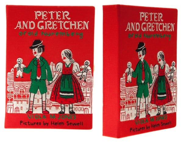 With its vibrant red cover, the Peter and Gretchen clutch by Olympia Le-Tan is perfect for fall and winter fashion