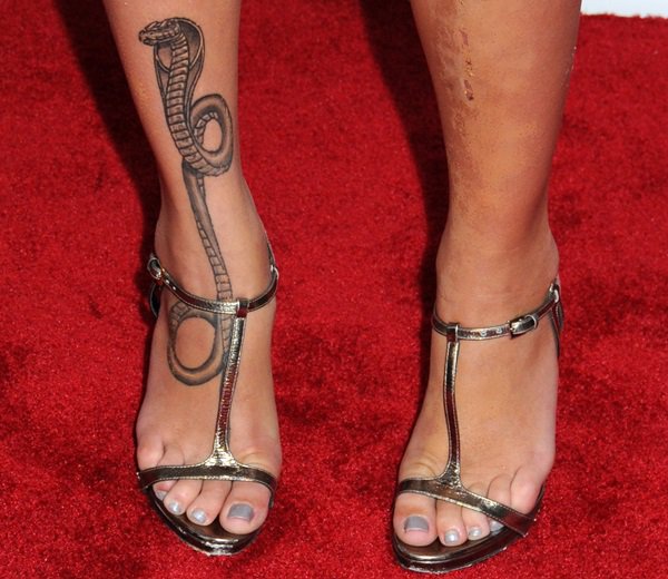 Paz De La Huerta has a king cobra tattooed on her right foot that wraps around her slim ankles