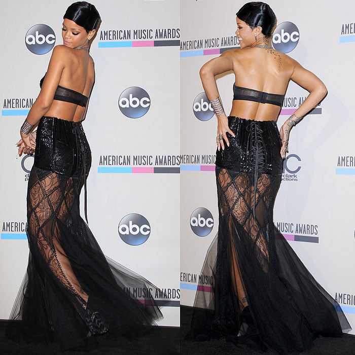 Rihanna poses and shows off the lace-up corset detailing on her Jean Paul Gauthier dress