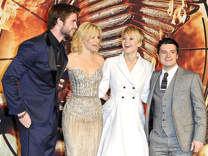 Liam Hemsworth plays the role of Gale Hawthorne, Elizabeth Banks plays the role of Effie Trinket, Jennifer Lawrence plays the role of Katniss Everdeen, and Josh Hutcherson plays the role of Peeta Mellark in the film adaptation of "The Hunger Games: Catching Fire"