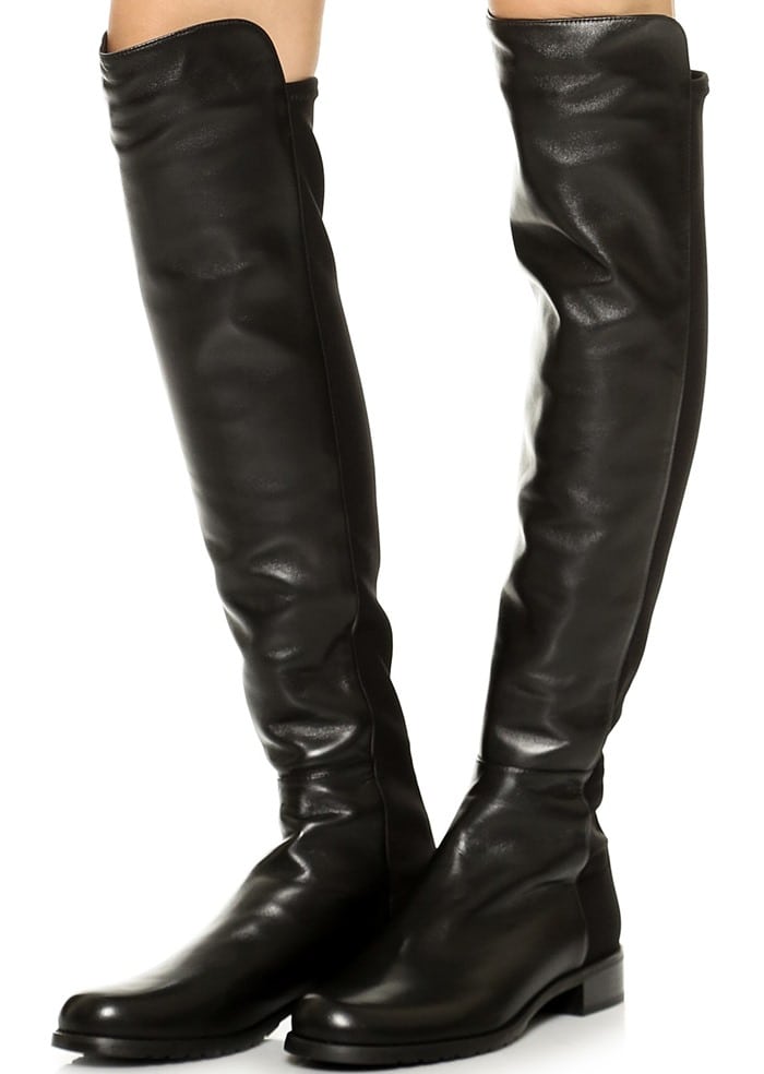 Stuart Weitzman's iconic 5050 over-the-knee boot in supple leather is fitted with a stretchy back panel for a sleek, comfortable fit that adjusts perfectly to your silhouette, making this wardrobe-staple style a favorite among editors, stylists, and celebrities