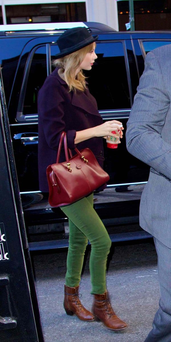 Taylor Swift spotted in NYC wearing a Free People Patton hat, Vince coat, Koral jeans, Frye boots, and a Tod's tote bag