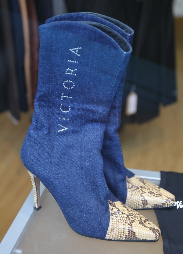 Snake print and blue denim boots sold to help victims of Typhoon Haiyan in the Philippines