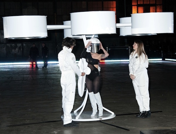 Lady Gaga places a helmet on her head as she prepares to fly her "Volantis" dress