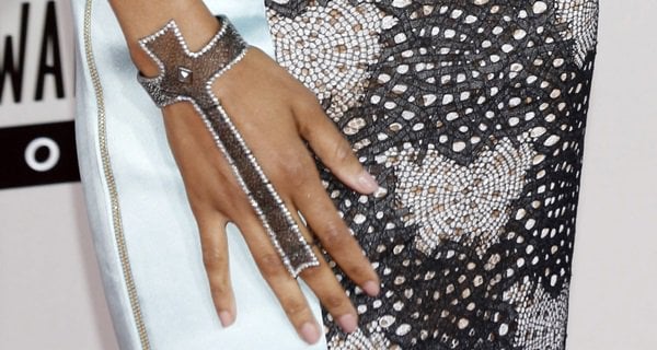 Zoe Saldana shows off her cross-shaped hand jewelry by Loree Rodkin