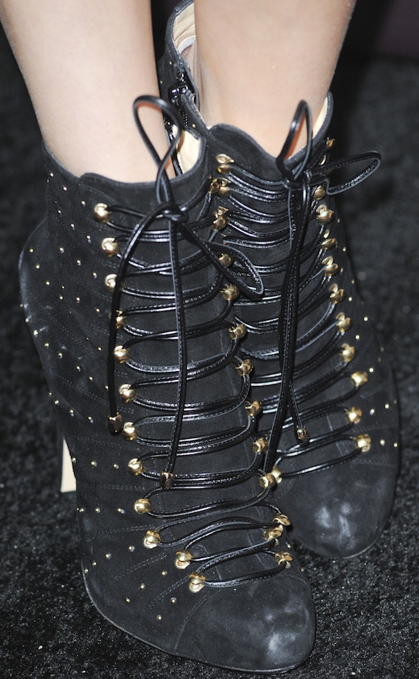 Bella Thorne in black lace-up booties