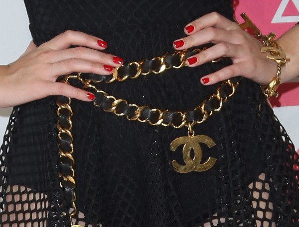 Up close with the Vintage Chanel Massive 3 row chain belt that Katy wore with her Chanel charm bracelet