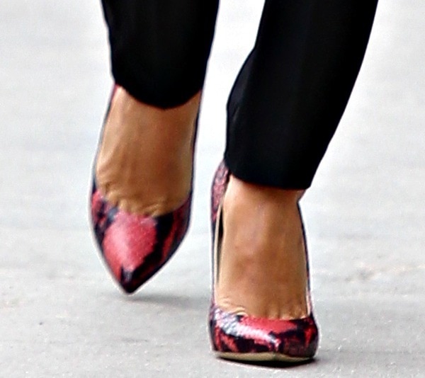 Eva Longoria shows off her feet in sexy red snake-print pumps