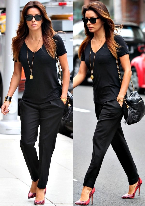 Eva Longoria wearing a plain black shirt with matching dark trousers