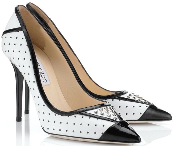 These pumps are crafted from a mix of punctured white leather and black patent leather for the trimmings