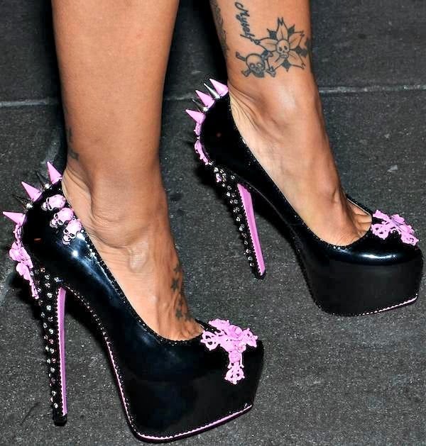 Jodie Marsh wearing pink-and-black platform pumps embellished with studs, spikes, and skulls