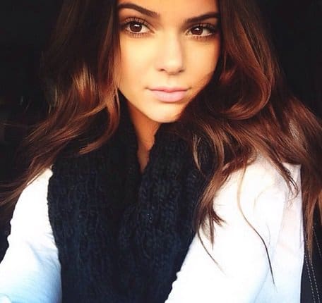 Kendall looks stunning in a knitted black scarf while taking a selfie inside the car on October 10, 2013