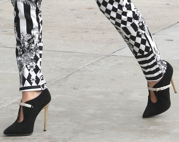 Kourtney Kardashian styled her skinny harlequin pants with Roberto Cavalli ankle booties