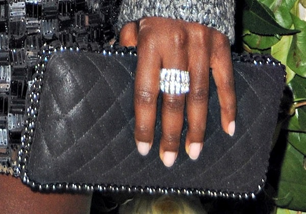 Lupita Nyong'o totes a black quilted clutch from Chanel