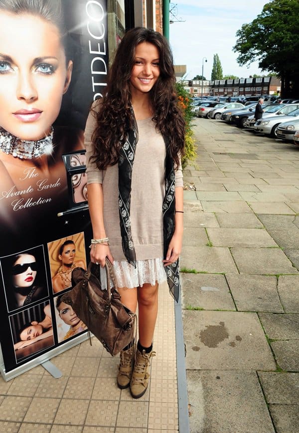 Michelle Keegan wears the skull scarf with a slouchy sweater and lace skirt while heading to Hoopers Department Store in England on October 2, 2010