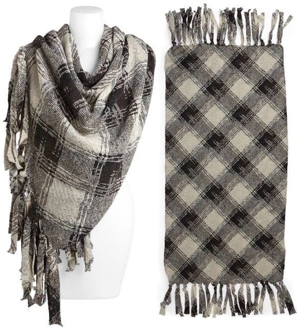 Wide fringe brings a homespun feel to a classic plaid wrap crafted in Italy