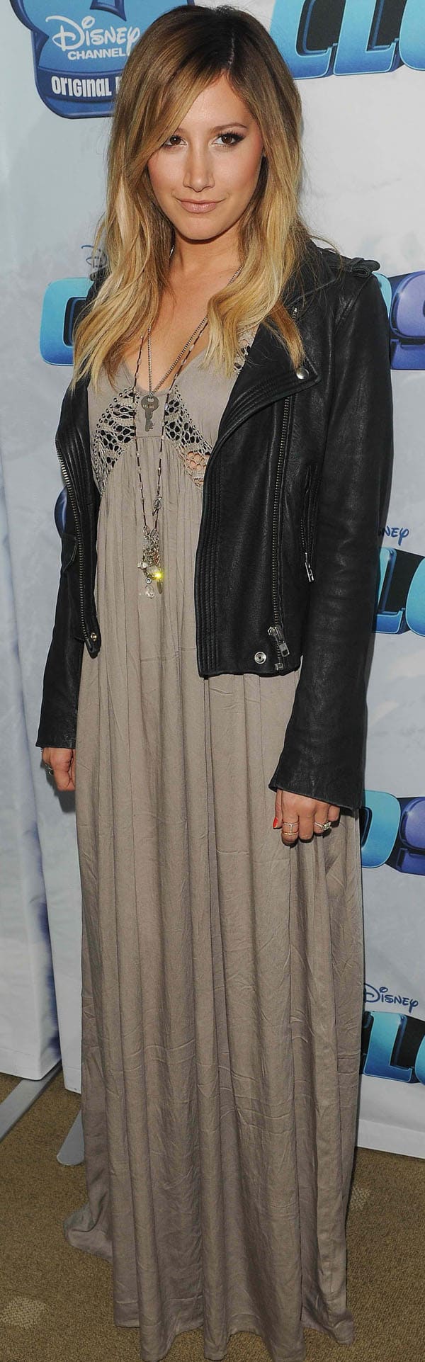 Ashley Tisdale looked effortlessly chic at the Cloud 9 premiere on December 18, 2013, donning a taupe Blesse'd are the Meek San Jose maxi dress paired with a noir IRO Ashville leather jacket, accessorized with an elegant Alexa Leigh gold pave diamond Elijo ring