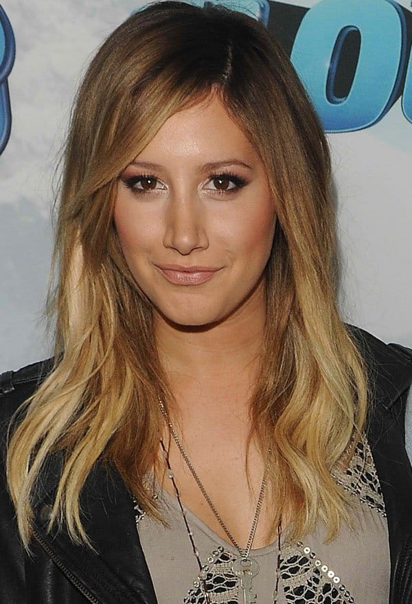Ashley Tisdale looks stunning with her wavy blonde hair complemented by subtle makeup