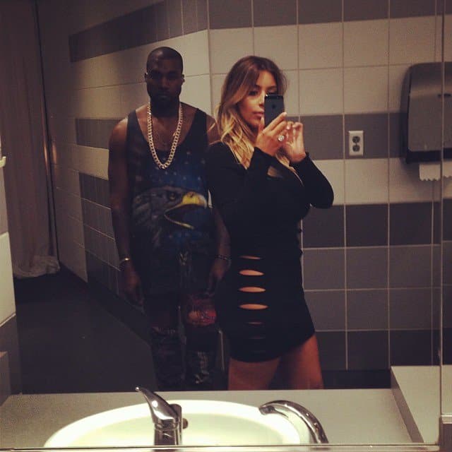 Kim Kardashian strikes a pose in a daring dress before Kanye West's concert in Miami, November 30, 2013
