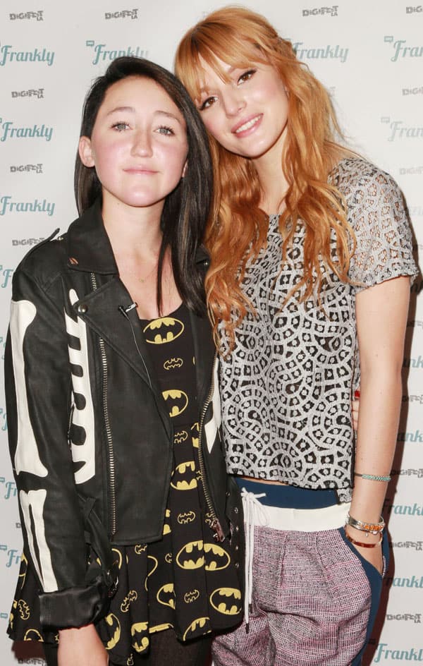 Bella Thorne with Noah Cyrus, who is wearing a Batman-themed outfit and a skeleton jacket